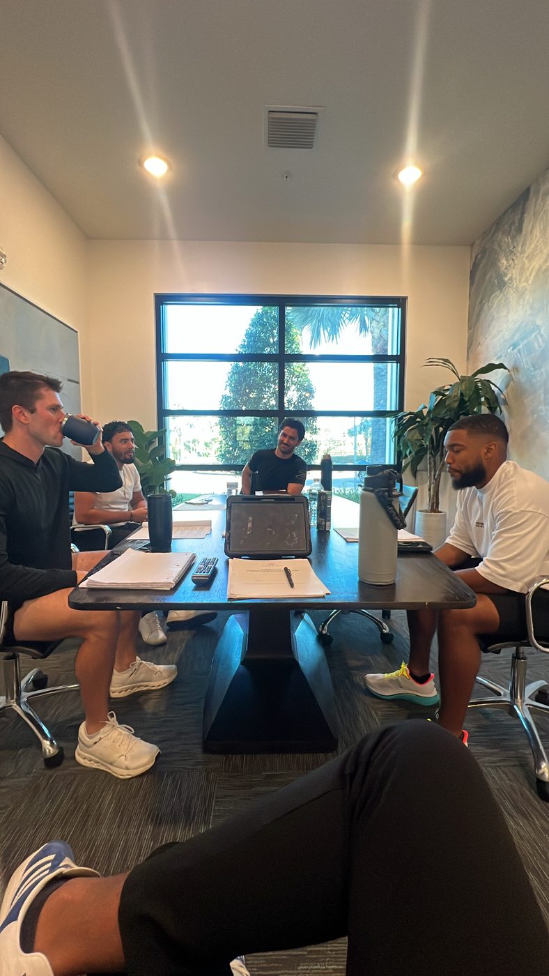 Men working through a Mental Performance Lab session around the table